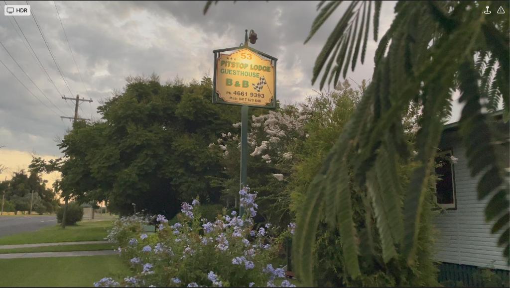 a sign for a restaurant on the side of a street at Pitstop Lodge Guesthouse B&B in Warwick