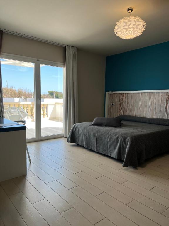 Postel nebo postele na pokoji v ubytování Tabù Hotel