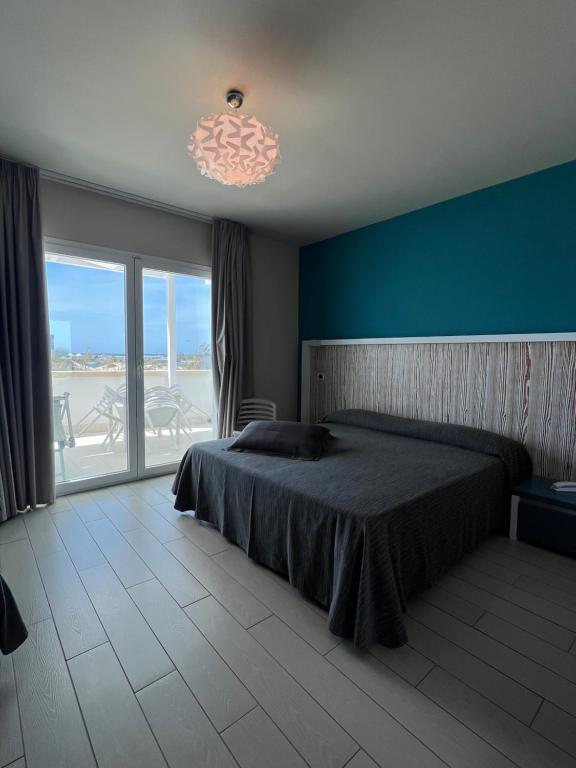 Postel nebo postele na pokoji v ubytování Tabù Hotel