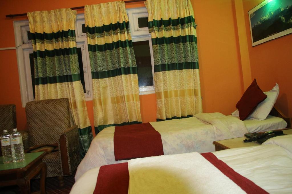Krevet ili kreveti u jedinici u objektu Hotel Pathibhara
