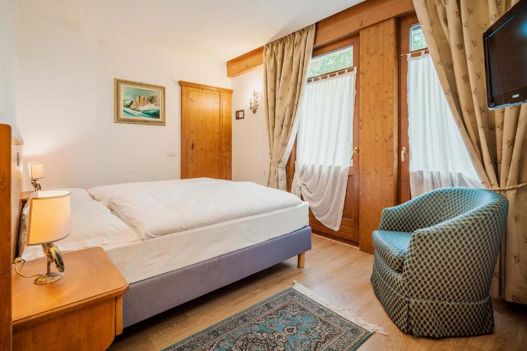Postel nebo postele na pokoji v ubytování Franceschi Park Hotel