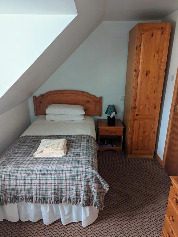 Postel nebo postele na pokoji v ubytování Doune Braes Hotel