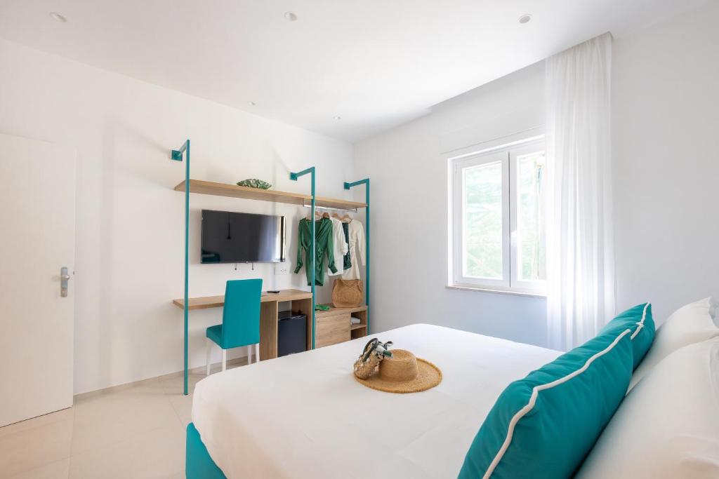 Postel nebo postele na pokoji v ubytování Vittoria Rooms Sorrento