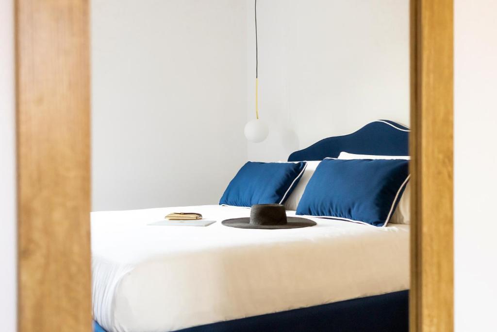 Postel nebo postele na pokoji v ubytování Vittoria Rooms Sorrento