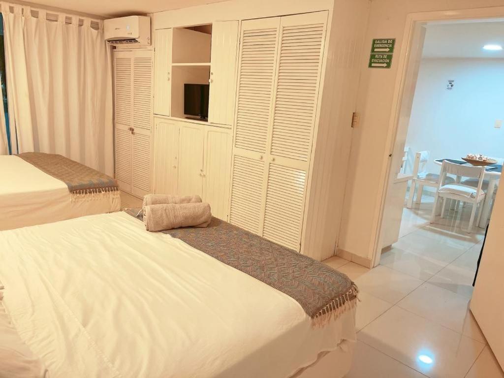 Postel nebo postele na pokoji v ubytování Espectaculares Aptos Hansa Coral San Andres Islas