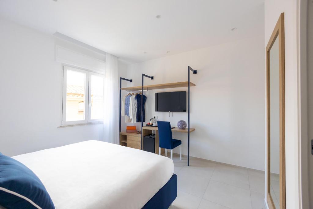 Postel nebo postele na pokoji v ubytování Vittoria Rooms Sorrento