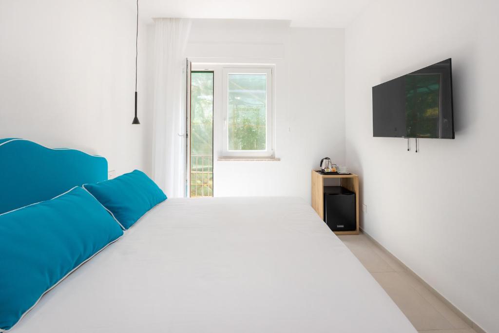 TV a/nebo společenská místnost v ubytování Vittoria Rooms Sorrento
