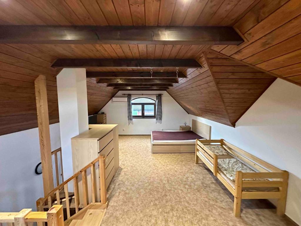 Postel nebo postele na pokoji v ubytování Penzion - Apartman Přestavlky