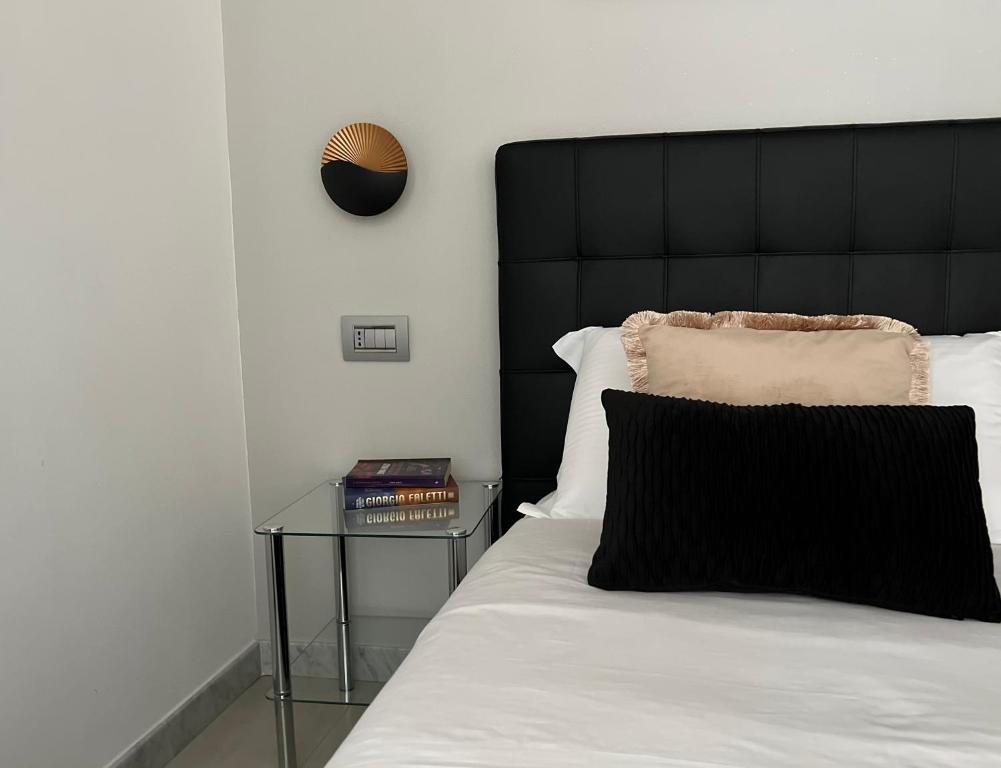 Postel nebo postele na pokoji v ubytování EVA affittacamere