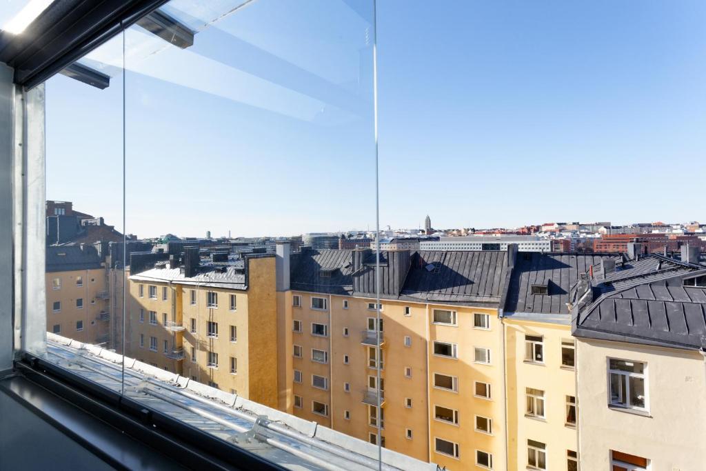 a view of a city from a window at Forenom Serviced Apartments Helsinki Kruununhaka in Helsinki