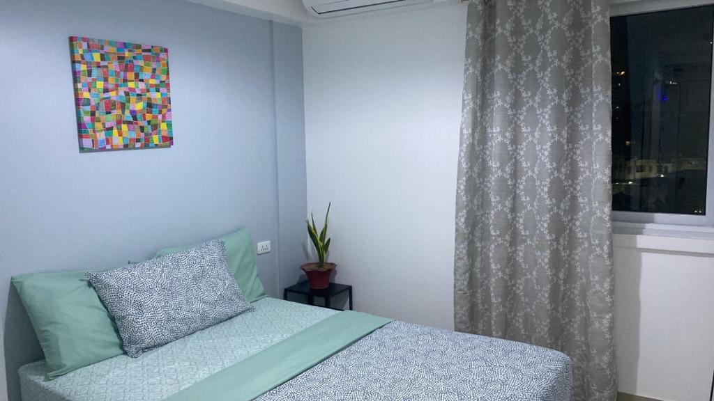 Postel nebo postele na pokoji v ubytování Cebu Mini Hotel