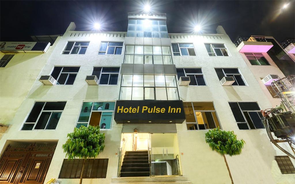 a building with a hotel police firm sign on it at Hotel Pulse Inn Jaipur in Jaipur