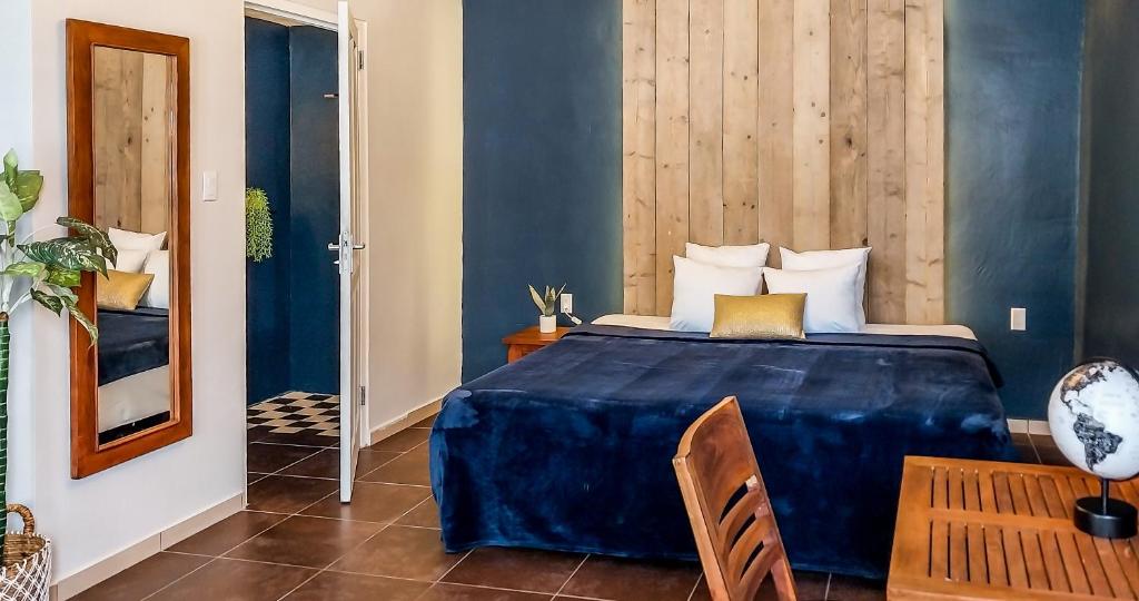 Postel nebo postele na pokoji v ubytování Atelier Skalo Boutique Hotel