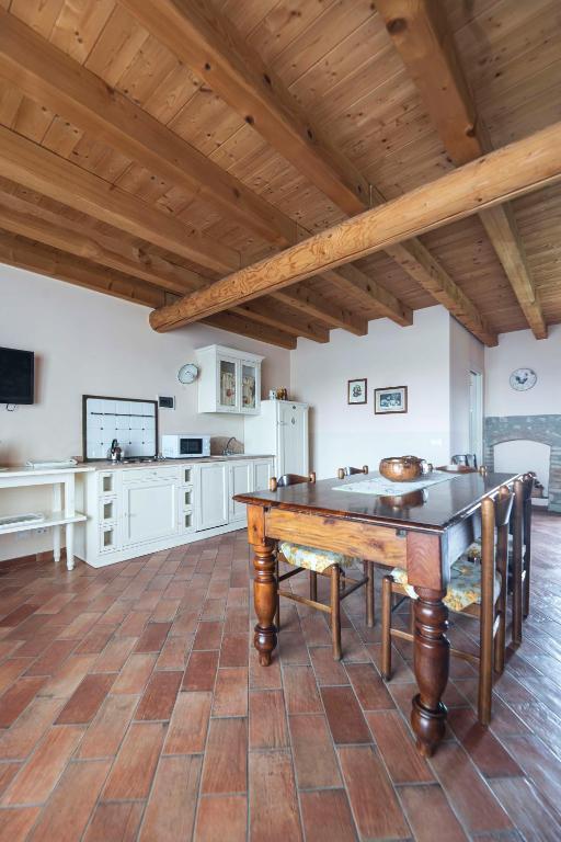 Kuchyň nebo kuchyňský kout v ubytování Fenil Conter Cottage & Suite