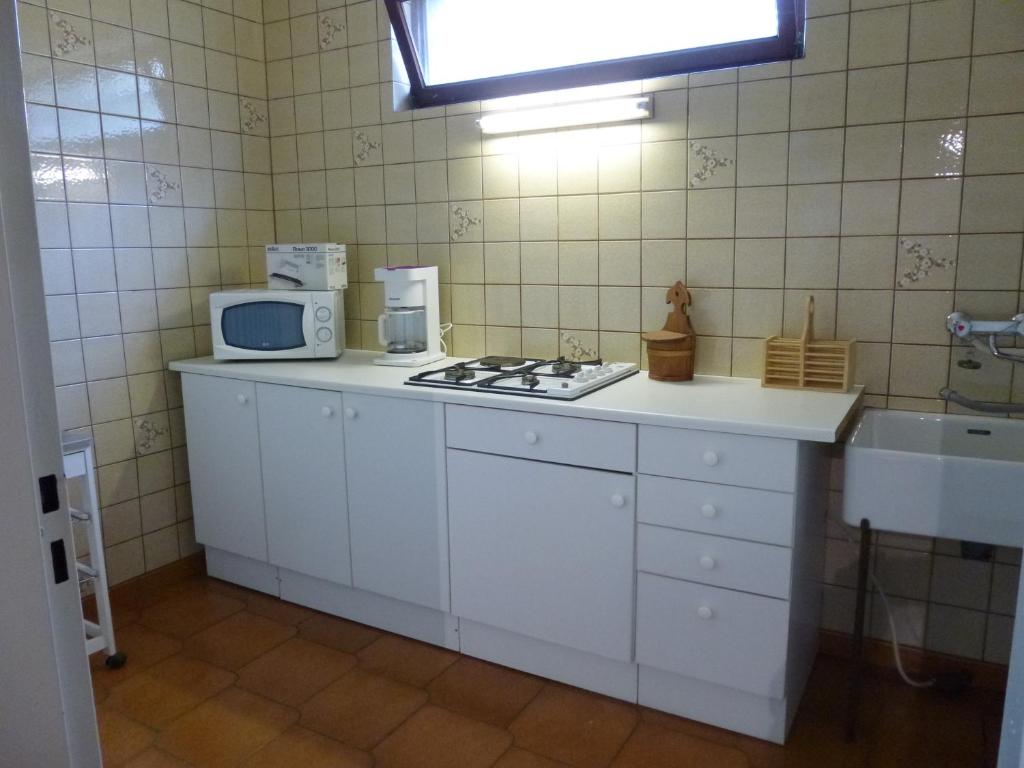 Kuchyň nebo kuchyňský kout v ubytování Jardin Fleuri