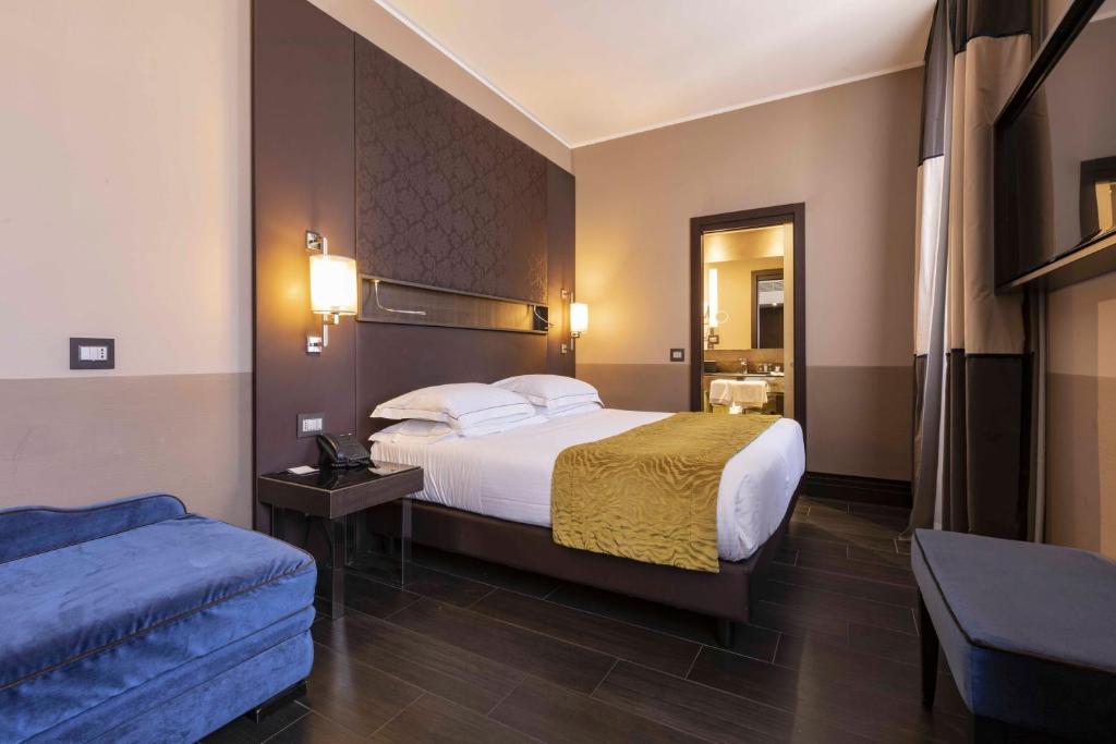 Postel nebo postele na pokoji v ubytování Rome Times Hotel