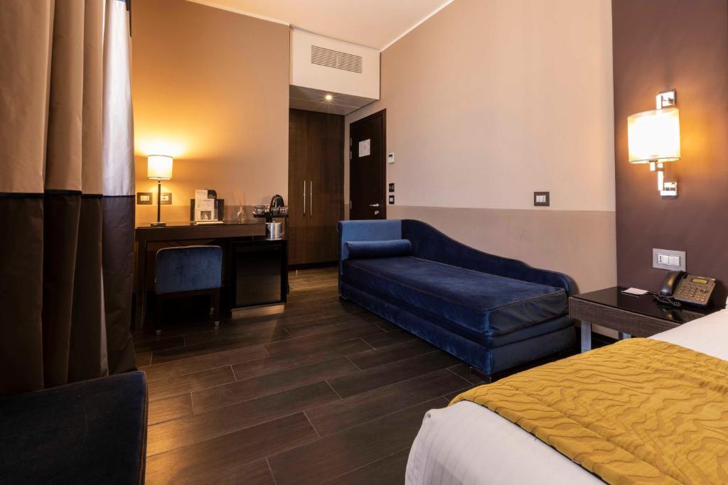 Postel nebo postele na pokoji v ubytování Rome Times Hotel