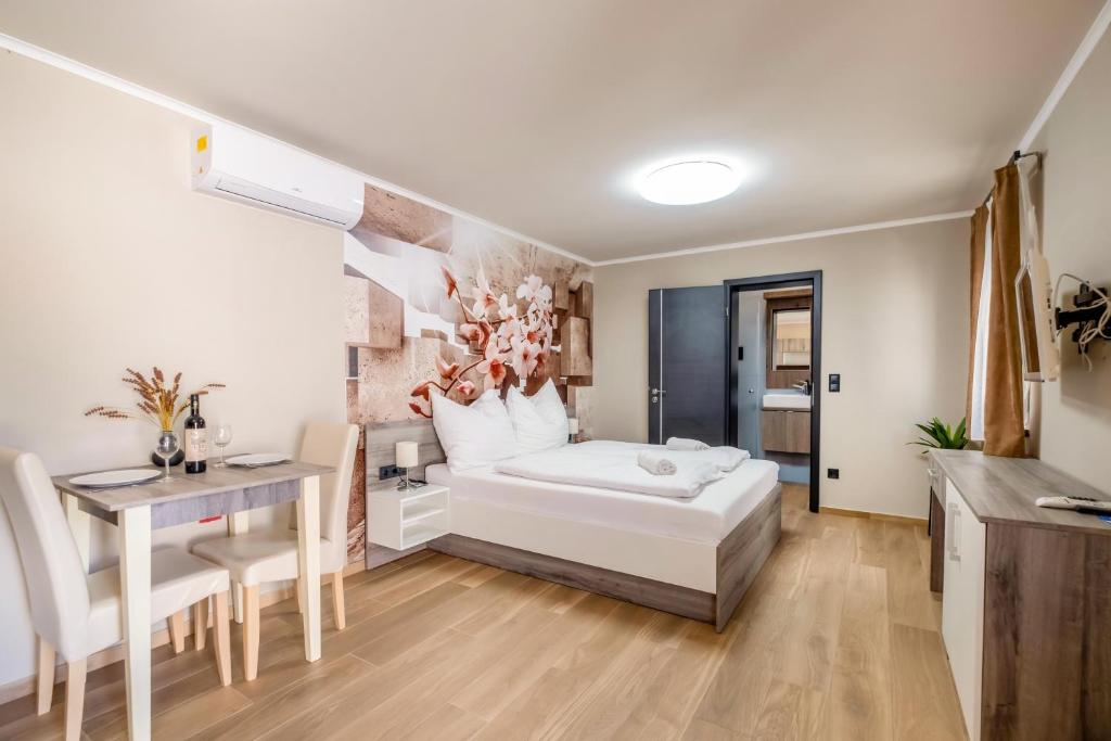 Łóżko lub łóżka w pokoju w obiekcie MyFlat Premium Resort