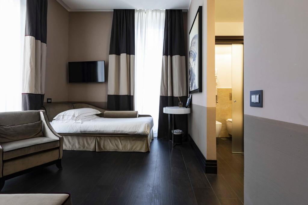 Postel nebo postele na pokoji v ubytování Rome Times Hotel
