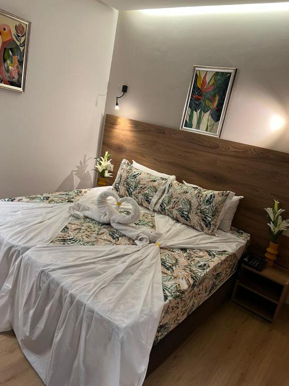 Postel nebo postele na pokoji v ubytování Hotel beaux arts