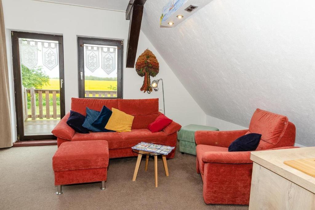 a living room with two chairs and a couch at 3-R-Ferienwohnung-fuer-3-Personen-in-Schaprode-auf-Ruegen-Zi4 in Schaprode