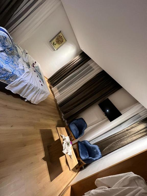 Postel nebo postele na pokoji v ubytování Hotel beaux arts