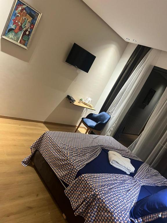 Postel nebo postele na pokoji v ubytování Hotel beaux arts