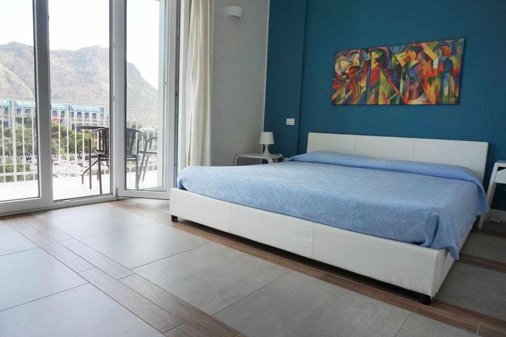 Postel nebo postele na pokoji v ubytování Favorita blue la tua suite a Palermo