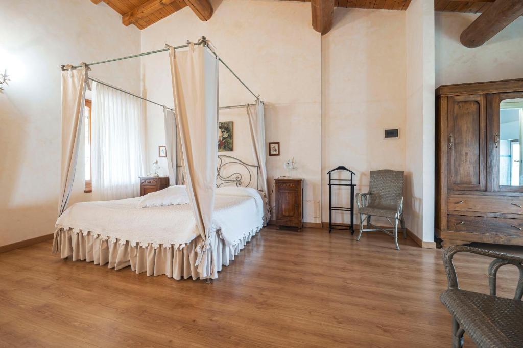 Postel nebo postele na pokoji v ubytování Fenil Conter Cottage & Suite