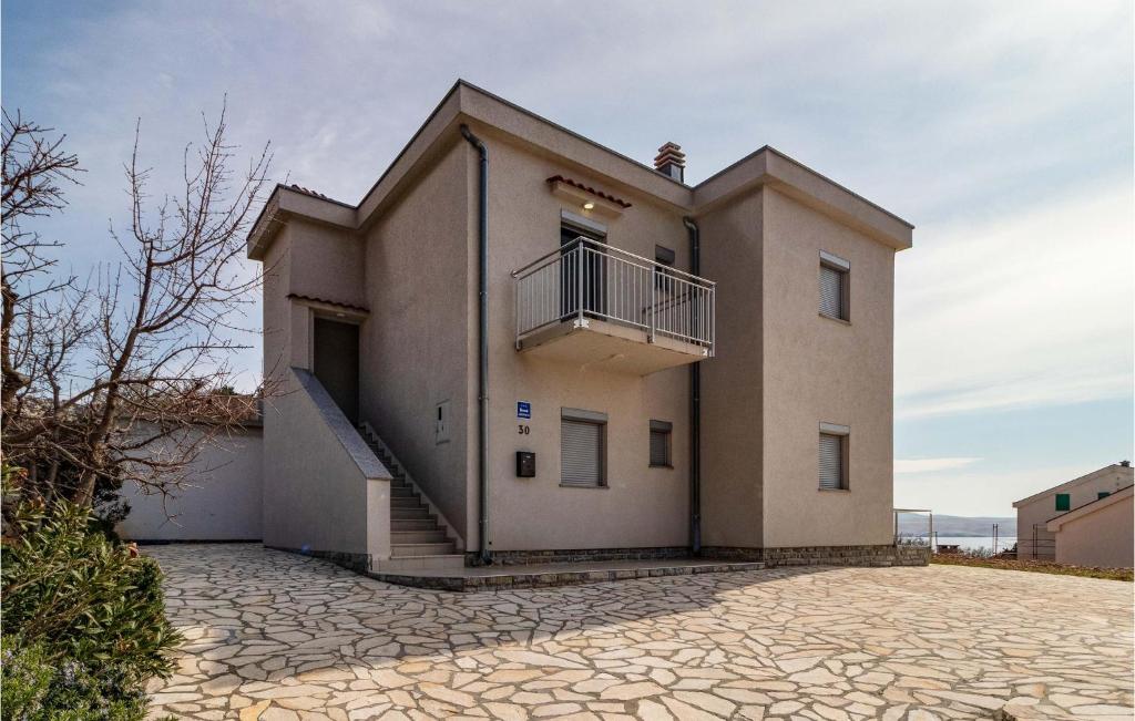 a house with a balcony and a staircase on it at Nice Apartment In Ribarica - Karlobag in Matić Podi
