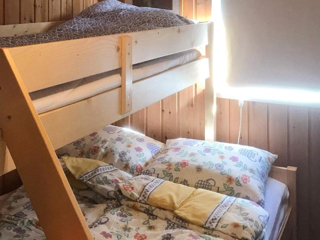Postel nebo postele na pokoji v ubytování Holiday home SORTLAND III