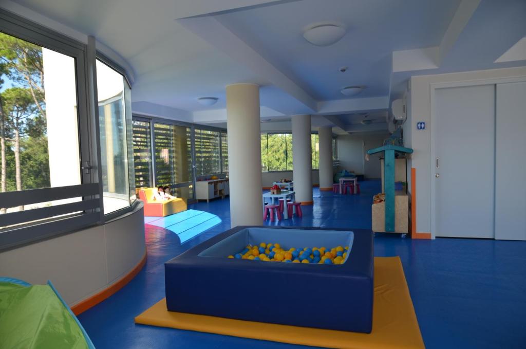 a large room with a pool in the middle of it at Laguna Park Hotel 4Superior in Bibione