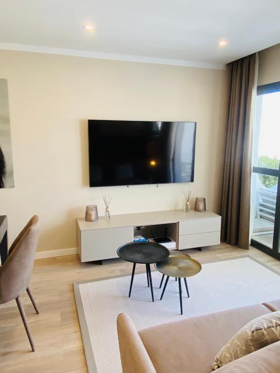 A television and/or entertainment centre at A.M. LUXURY HOME IN PUERTO RICO