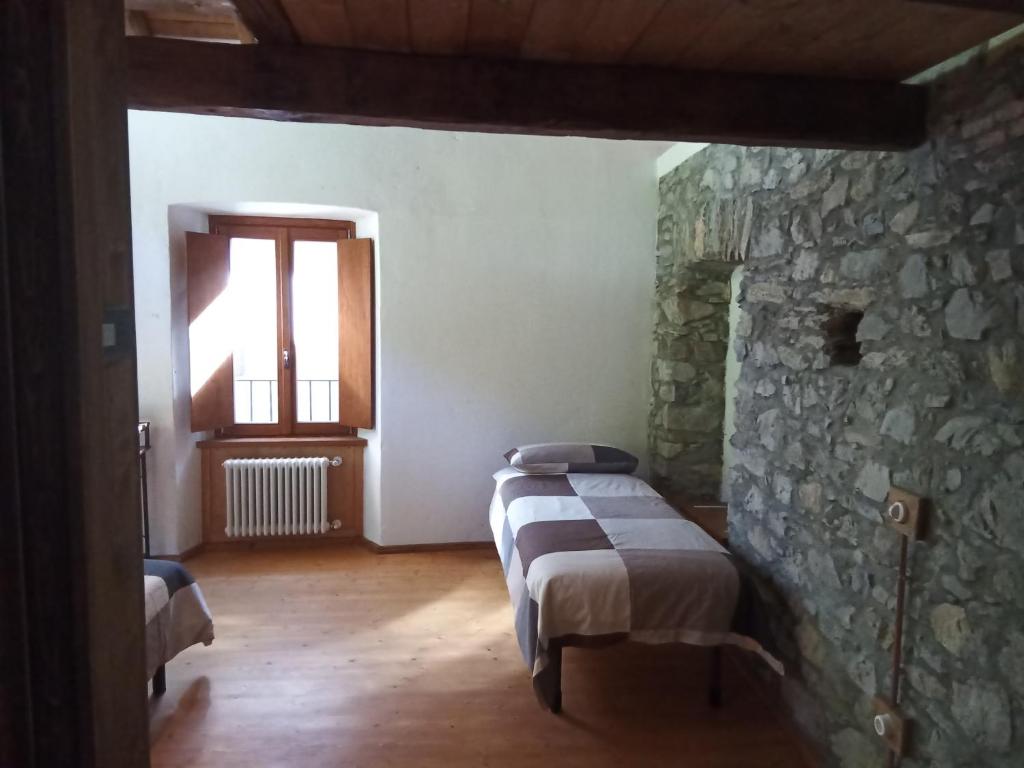 Postel nebo postele na pokoji v ubytování Ca' dei Codirossi