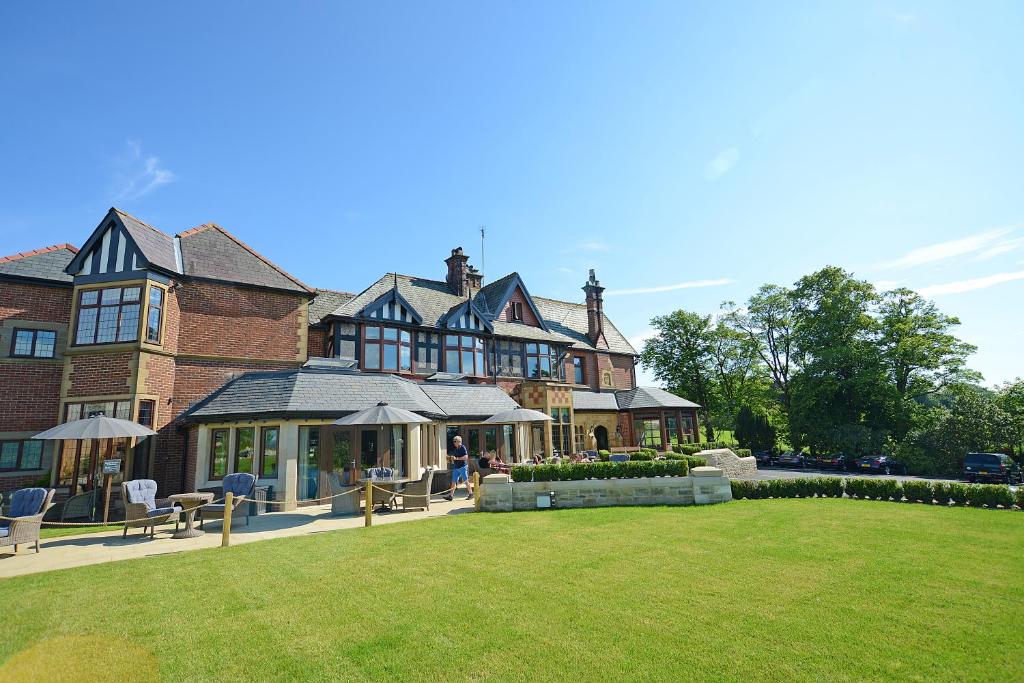 a large house with a lawn in front of it at Northcote in Langho