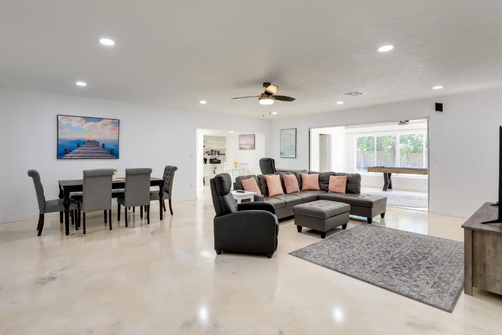 a living room with a couch and a table and chairs at Airy Bradenton Vacation Rental with Patio, Gas Grill in Bradenton