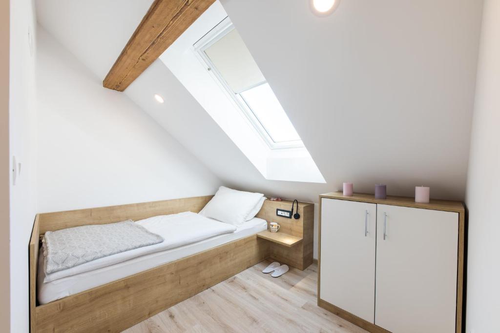 Postel nebo postele na pokoji v ubytování Apartments Repinc
