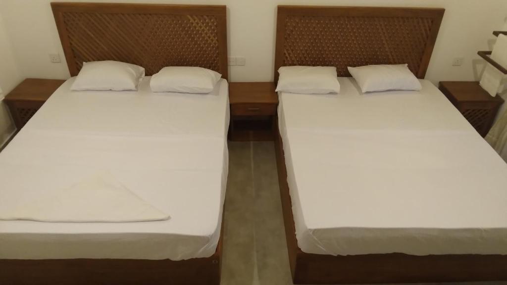 Postel nebo postele na pokoji v ubytování Serenity Villa Anuradhapura