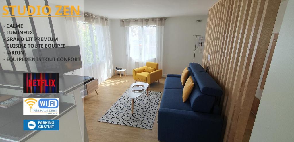 a living room with a blue couch and a yellow chair at Studio Zen in Niort