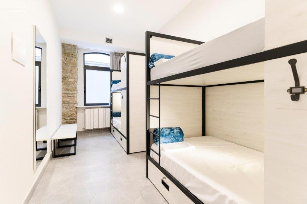 a dorm room with bunk beds in it at LOGUNE ROOMS in Vitoria-Gasteiz