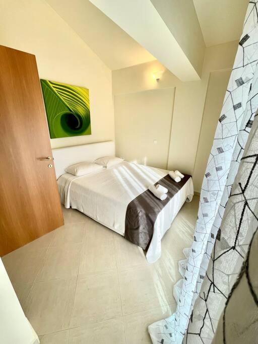 Postel nebo postele na pokoji v ubytování Seaside Getaway Kriopigi