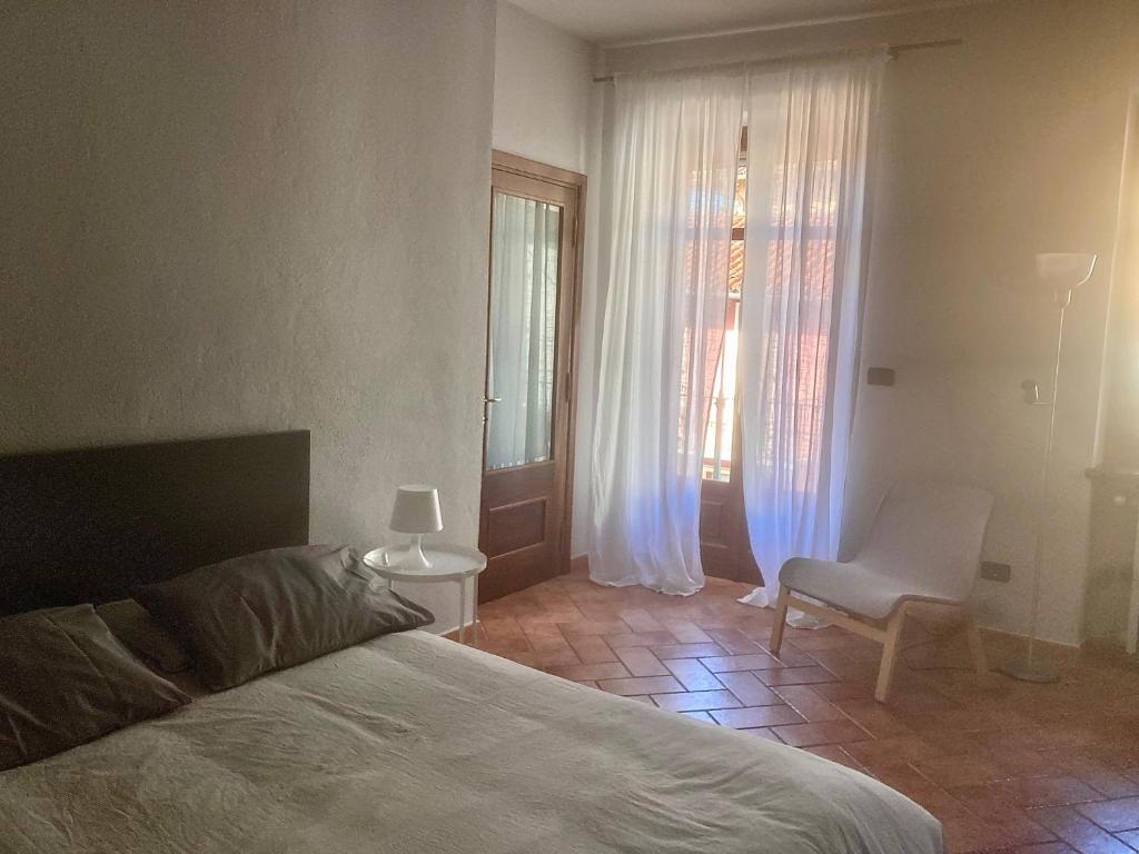 A bed or beds in a room at da Emi - La casetta in piazza