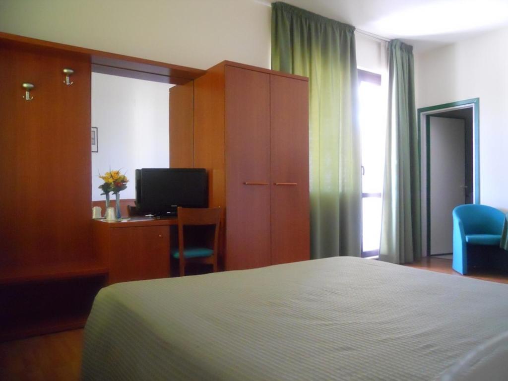 Postel nebo postele na pokoji v ubytování Hotel Traghetto