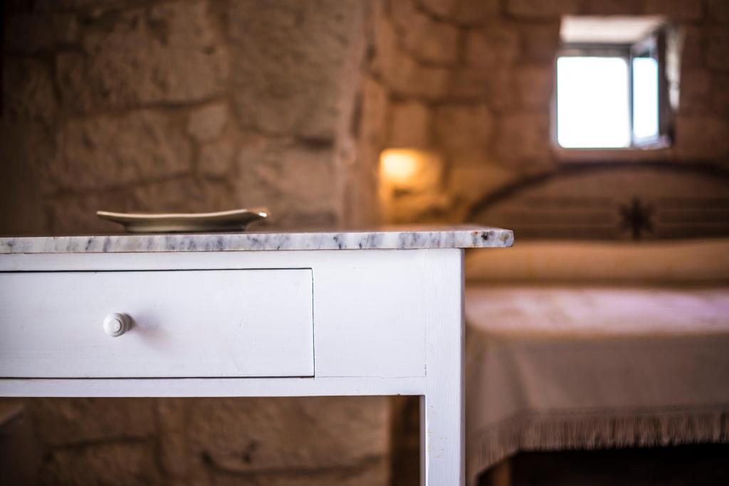 Postel nebo postele na pokoji v ubytování Trullo fiore