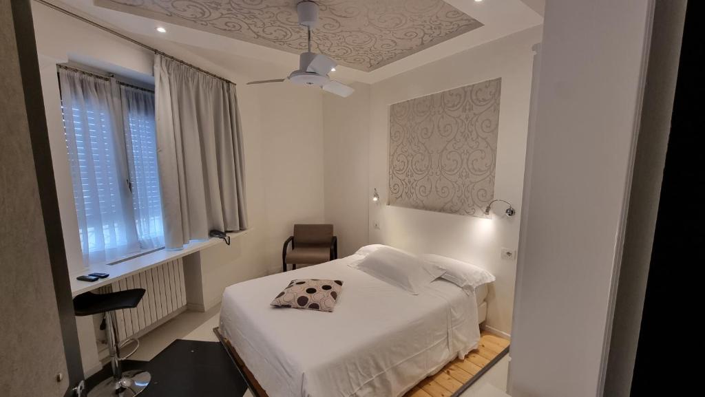 Postel nebo postele na pokoji v ubytování Albergo Ristorante Trieste Boves