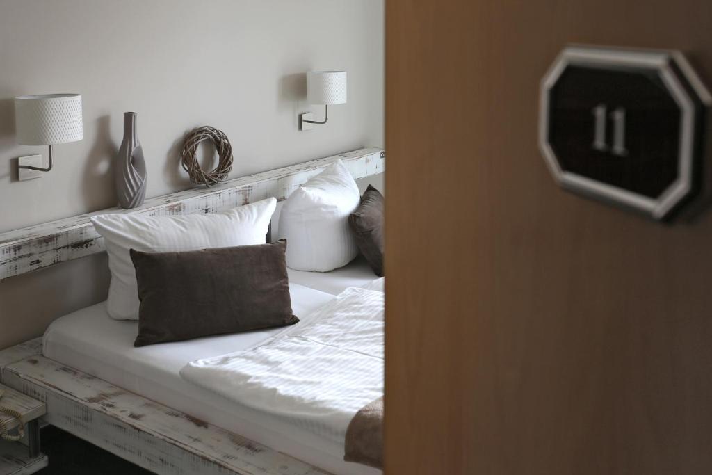 Postel nebo postele na pokoji v ubytování Hotel & Restaurant Utkiek
