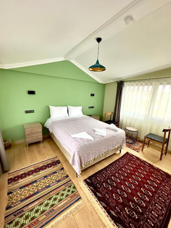 Postel nebo postele na pokoji v ubytování Terrace Guesthouse