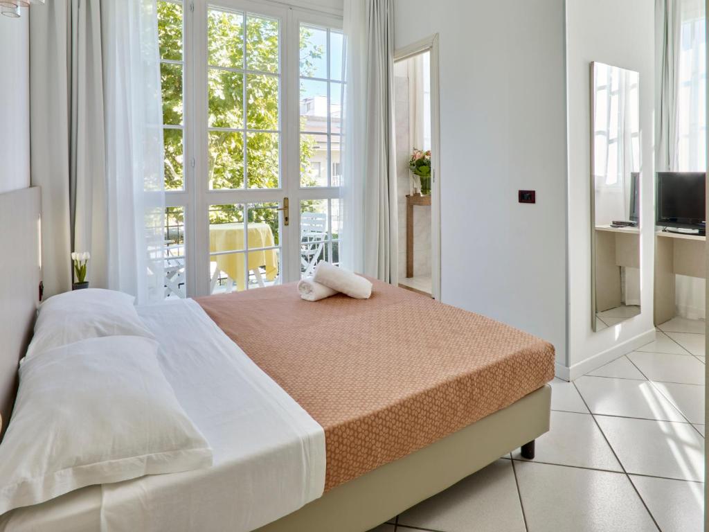 Postel nebo postele na pokoji v ubytování Marittima Rooms