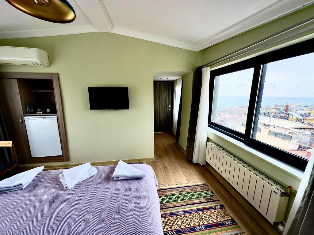 Postel nebo postele na pokoji v ubytování Terrace Guesthouse