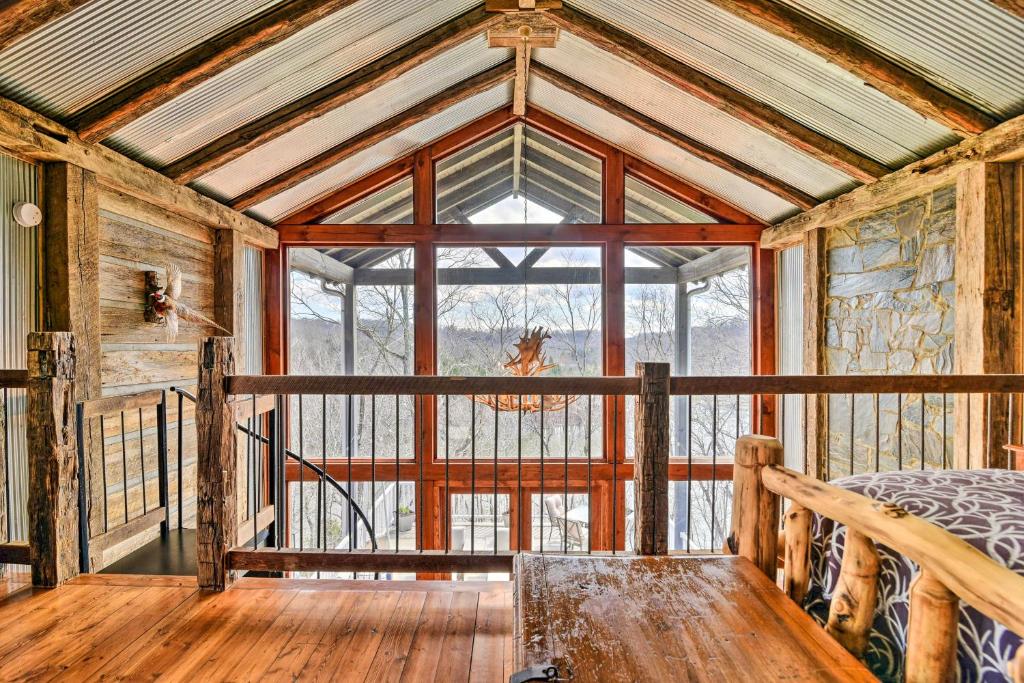 a room with a large window and a bed in it at Lakefront Lewisburg Vacation Rental with Deck! in Lewisburg